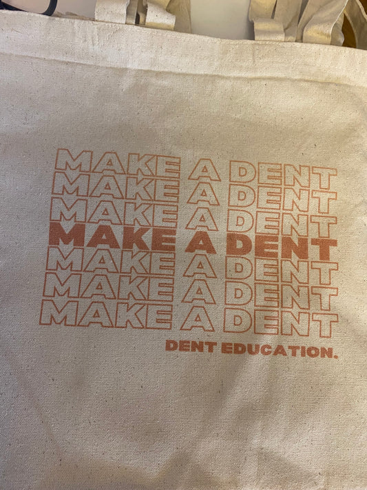'Make A Dent' Beige Tote Bag