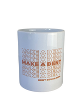 Load image into Gallery viewer, Make A Dent Cascade Ceramic Mug
